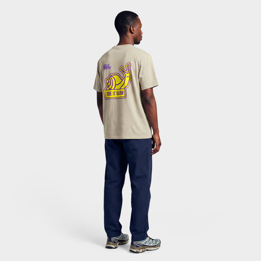 VELODROM Take It Slow Camiseta - Sand Yellow/Purple Graphics
