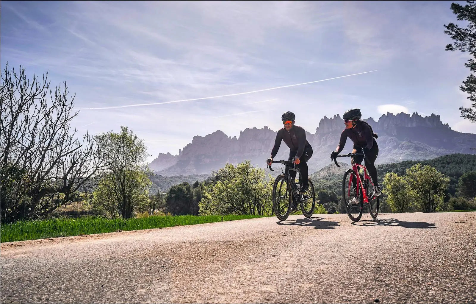 Road cyclists with Montserrat in the background