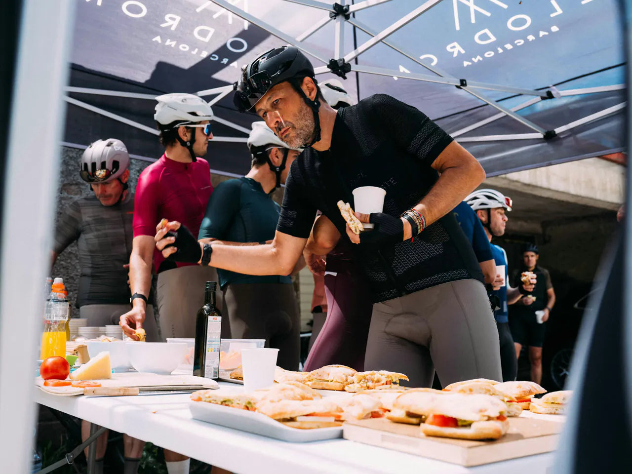 Riders at the Velodrom feed table under the team tent