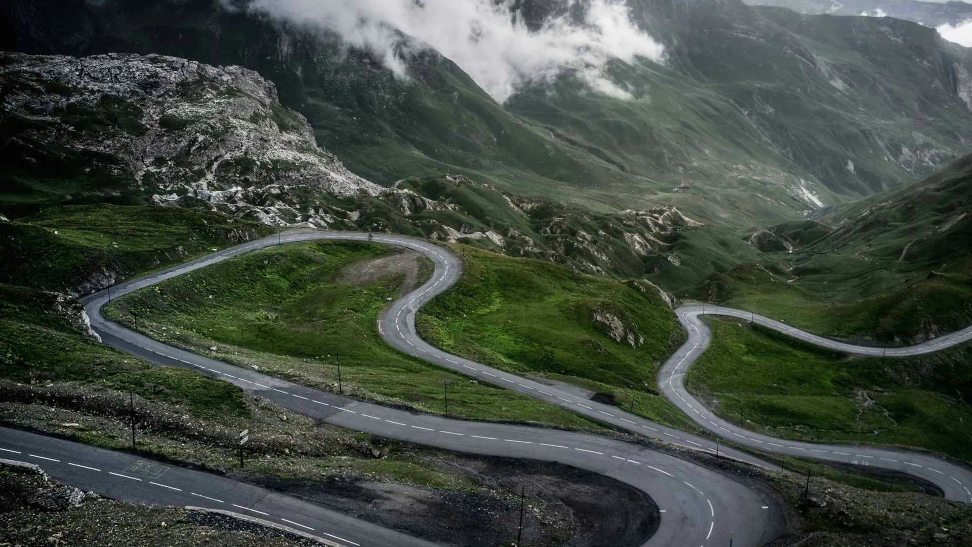 Alpine hairpins disappearing into the clouds